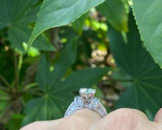 #148 - One, round European cut diamond of about 1.54 ct (VVS2, L-N color range) One platinum fifty-seven stone, cast made ring. 14 round full cut diamonds 1.50mm. (SI 1 - GH color range). 42 baguette cut diamonds (SI 1- GH color range) - Size 5- Appraisal & price available upon request.