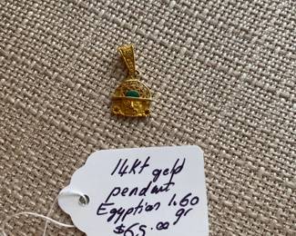 #136 B - $65 - 14kt gold pendant Egyptian 1.60 grams