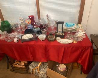 baby crib under table, basket, glassware, platters and vases