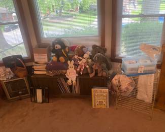 Record cabinet, stuffed animals, blankets, gold stand, etc