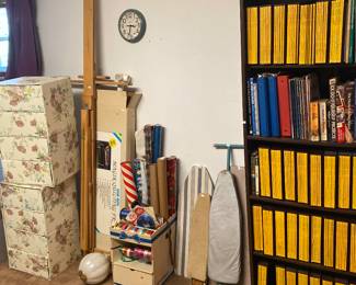 ironing boards, quilting frame, readers digest magazines, storage boxes, ribbon box