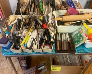 utensils, cooking magazines under table