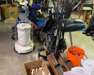 Kerosene heater, ski machine, weight bench, fishing net, extension cords x 20