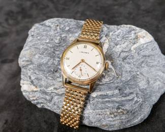 Antique gold Longines watch with a solid 14k gold case and a solid 14k gold bracelet, both marked and tested. Watch winds up and works as it should. 32mm case with bezel and 38mm lug to lug. Total approx. weight is 51.45 grams.