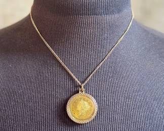 A 1776 Liberty $20 Replica coin, gold-plated necklace. 18" in length.