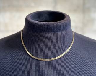 A vintage 10k gold chain measuring at 18''. No visible markings, but professionally tested positive for 10k gold. Total approx. weight of 11.72 grams.