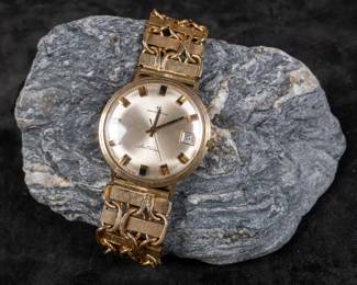 Vintage Hamilton watch with solid 14K gold case and solid 14K gold bracelet. Gold tested and is authentic. Watch appears to need servicing to function properly. 37mm case size with bezel and 37mm lug to lug. Appears to fit a 8''-9'' wrist. Lots of gold in this one! Total approx. weight is 79.59 grams.