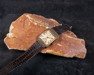 Vintage Accro watch with a 14k gold case. Case size 22mm, 31mm lug to lug. Does not appear to be currently running. Marked 14K on back of case. Max wrist size 8.5'' and on a genuine leather strap.