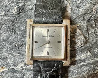 A Germinal Voltaire watch with a 14k gold case and a genuine leather band. Marked 14k on the back of case. 17 Jewels, winds and runs as it should. 26mm case size and a total approx. weight of 21.54 grams.