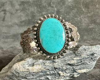 Artisan made sterling silver Turquoise cuff with intricate designs. Total approx. weight of 39.47 grams and measures 6.25'' around.