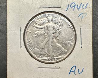 A 1944 P Walking Liberty Half Dollar, in estimated AU condition. Great strike and luster.

