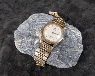 Vintage Omega watch on an original gold plated Omega bracelet. Winds and runs as it should. 34mm case size with bezel and 42mm lug to lug. Appears to fit a 7.5''-8'' wrist.