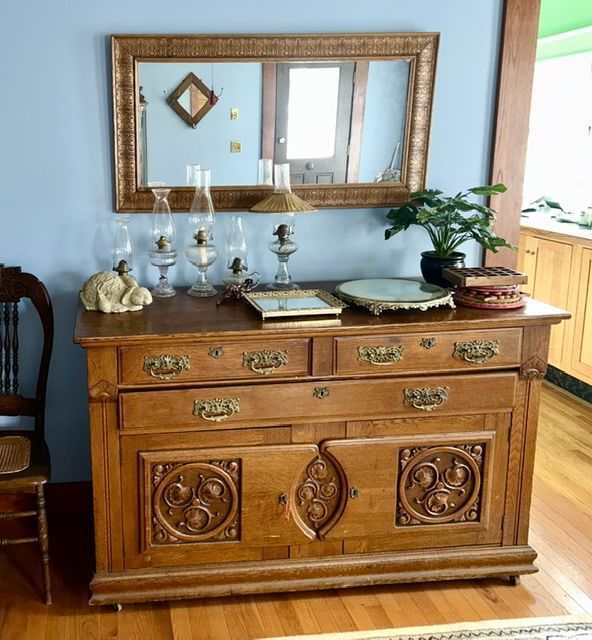 Beautiful antique buffet, kerosene oil lamps, dresser mirror