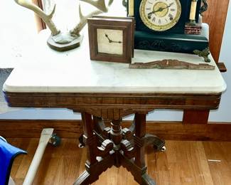 Antique parlor table w/ marble top, antique mantle clock (SOLD), large antler mount (SOLD)