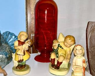 MCM round top red glass with cork on bottom, antique Hummel figures