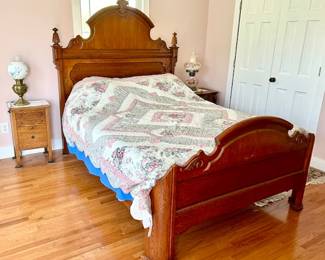Second view of bed with two side tables and vintage/antique lamps