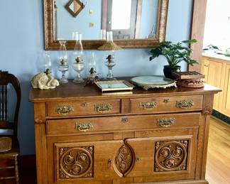 Beautiful antique buffet, kerosene oil lamps, dresser mirror