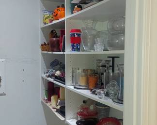 A lot of votive, candles,  vases, and unique hand blown glass.