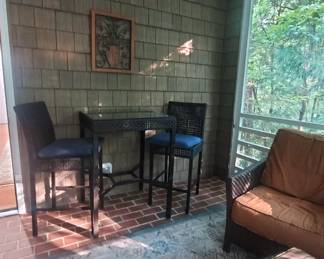 high top outdoor wicker table and 2 chairs.