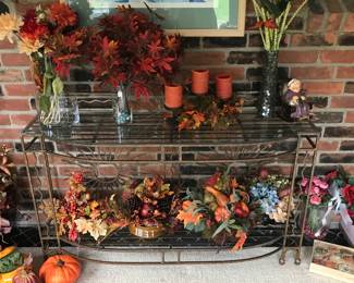 Cool glass topped console table adorned with fall foliage!