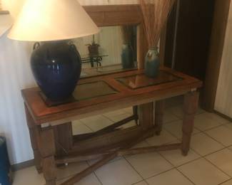 Another console table with a matching wall mirror! Blue ginger jar lamp. Hand crafted pottery vase for decor!