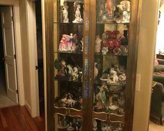 Impressive lighted display cabinet filled with collectibles!