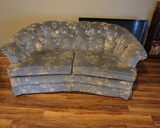 curved blue floral loveseat