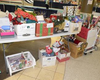 Holiday items in boxes, wrapping paper most items are brand new.