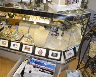 Necklaces, glass globes, rings, framed patches, watches, broches, pens, perfume bottle