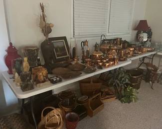 Extensive collection of copper, crystal, and wicker baskets