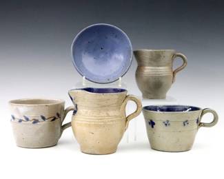Five pieces of 20th century Jugtown Pottery.  Various forms with Grey and Blue glazes, includes two creamers, two tea cups and a small footed bowl.  Impressed "Jugtown Ware" marks.  Minor wear, minor flakes to Cobalt glaze.  Up to 4 1/2" diameter and 4" high.  ESTIMATE $50-100