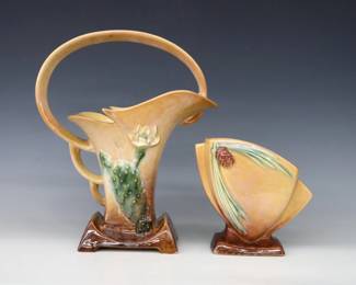 Two mid 20th century Roseville "Wincraft" Art Pottery vases with Orange/Brown lustre glaze.  Includes a flared basket with multi-color Cactus decoration, and a conical pillow vase with multi-color Pine Cone decoration.  Molded "Roseville / U.S.A" marks, larger with "210-12" and smaller with "272-6" model numbers.  Minor wear, some crazing.  6 1/4" and 12" high.  ESTIMATE $50-100