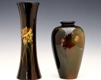 Two turn of the century Weller Louwelsa and Roseville Rozane vases with Brown Standard glaze.  Includes a Weller baluster vase with multi-color Cherry decoration, and a Roseville flared vase with multi-color Daffodil decoration.  Impressed "Weller Louwelsa" mark with "II" numerals, and impressed "Rozane" and "RPCo" marks with "961" model number and "X" factory mark.  Minor wear and some crazing.  7 3/4" high and 10 1/4" high.  ESTIMATE $50-100