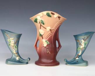 Three mid 20th century Roseville Art Pottery vases with multi-color Snowberry decoration.  Includes a flared vase with Mauve/Pink matte glaze, and a pair of cornucopia vases with Blue matte glaze.  Molded "Roseville / U.S.A" marks, larger with "IV2-9" and pair with "ICC-6" model numbers.  Minor wear, some crazing.  6" and 9 1/2" high.  ESTIMATE $50-100