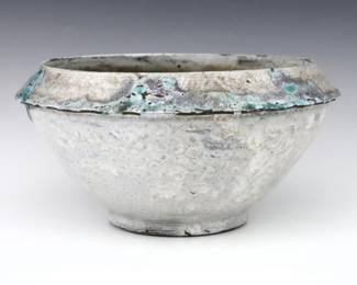 A 20th century Jugtown Pottery bowl.  Footed form with piecrust shoulder and mottled Chinese White glaze with Blue detail.  Impressed "Jugtown Ware" mark.  Minor wear, flakes and chips along piecrust edge some from production.  9 1/2" diameter x 4 3/4" high.  ESTIMATE $50-100