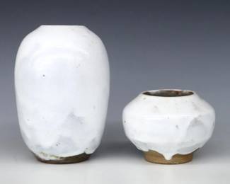 Two 20th century Jugtown Pottery vases.  Egg and bulbous forms with mottled Chinese White glaze.  Impressed "Jugtown Ware" marks.  Minor wear, some crazing.  3 1/2" and 6 3/4" high.  ESTIMATE $50-100