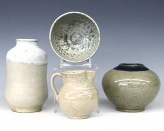 Four pieces of 20th century Jugtown Pottery.  Various forms with mottled Grey salt glazes, includes a cylindrical vase with White drip glaze detail, a bulbous vase with Cobalt Blue glazed detail, a footed bowl and a bulbous creamer with incised decoration.  Impressed "Jugtown Ware" marks, smaller vase dated "1985".  Minor surface wear, taller vase with small chip to foot.  Up to 5 1/4" diameter and 6 1/2" high.  ESTIMATE $50-100