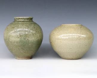 Two 20th century Jugtown Pottery vases.  Bulbous forms with mottled Green and Grey glazes.  Impressed "Jugtown Ware" marks.  Minor wear.  5 1/4" high and 6 1/4" high.  ESTIMATE $50-100