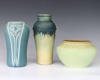 Three early 20th century Rookwood Art Pottery vases with Blue and Green matte glazes.  Includes a baluster vase with drip glaze, a high shouldered vase with molded floral decoration, and a rose bowl with molded floral decoration.  Impressed Rookwood marks, baluster vase with "2079" model number, "XVIII" (1918) date and artist initials "CJM" Charles Jasper McLaughlin (American, 1888-1964), shouldered vase with "2141" and "XXVI" (1926), rose bowl with "2179" and "XXXI" (1931), both taller vases with "X" factory marks.  Minor surface wear, some crazing, tallest with hairline at foot extending into the body.  3 3/4" to 7 1/4" high.  ESTIMATE $100-150