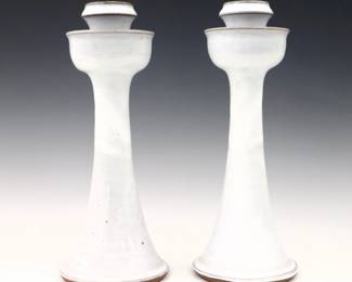 A pair late 20th century Vernon Owens for Jugtown Pottery candlesticks.  Flared forms with Chinese White glaze.  Impressed "Jugtown Ware" marks with "Vernon Owens" and "1987" date.  Minor wear.  11 3/4" high.  ESTIMATE $50-100