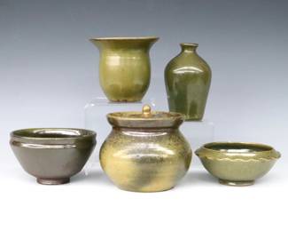 Five pieces of 20th century Jugtown Pottery.  Various forms with mottled Green Frogskin glaze, includes a covered jar, flared vase, jug vase and two footed bowls.  Impressed "Jugtown Ware" marks.  Minor surface wear, jar with repaired break to lid.  Up to 4 1/2" diameter and 4 1/2" high.  ESTIMATE $50-100