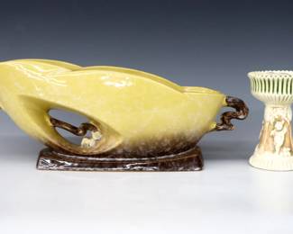 Two pieces of early and mid 20th century Roseville Art Pottery.  Includes an early flared "Donatello" vase with flower frog insert, multi-color Cherub decoration and Ivory glaze, and a later oval center bowl with multi-color "Ming" Tree decoration and Yellow/Brown lustre glaze.  Center bowl with molded "Roseville / U.S.A." mark and "1062-12" model number, vase unmarked.  Vase with repaired or re-painted interior, both with some crazing.  15" long and 5" high.  ESTIMATE $50-100