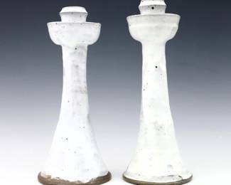 Two 20th century Jugtown Pottery candlesticks.  Flared forms with Chinese White glaze.  Impressed "Jugtown Ware" marks.  Minor wear.  Up to 11 1/2" high.  ESTIMATE $50-100