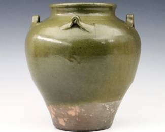 A 20th century Jugtown Pottery vase.  Chinese style urn form with applied handles and mottled Green Frogskin glaze.  Impressed "Jugtown Ware" mark.  Minor surface wear and light scratches, flakes at underside.  7 3/4" high.  ESTIMATE $50-100