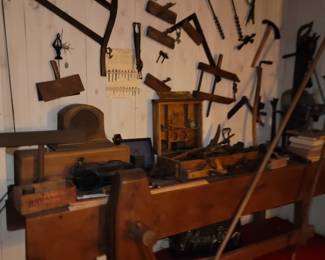 Great assortment of antique hand tools and antique workbench 