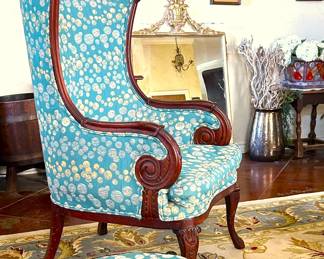 Custom upholstered antique highback chair with beautiful carved wood details 