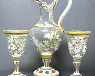 Hand painted enamel details on white glass cut to clear wine goblets and ewer,  most likely by Moser 