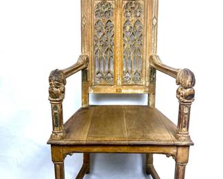 Antique Gothic arm chair with beautiful hand carved detail and with touches of polychrome paint detail 