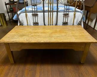 Antique English 19th century pine table that was cut down to serve as a coffee table 