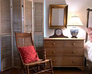 Antique rocking chair, wooden shutter screen and 19th century English pine chest of drawers.